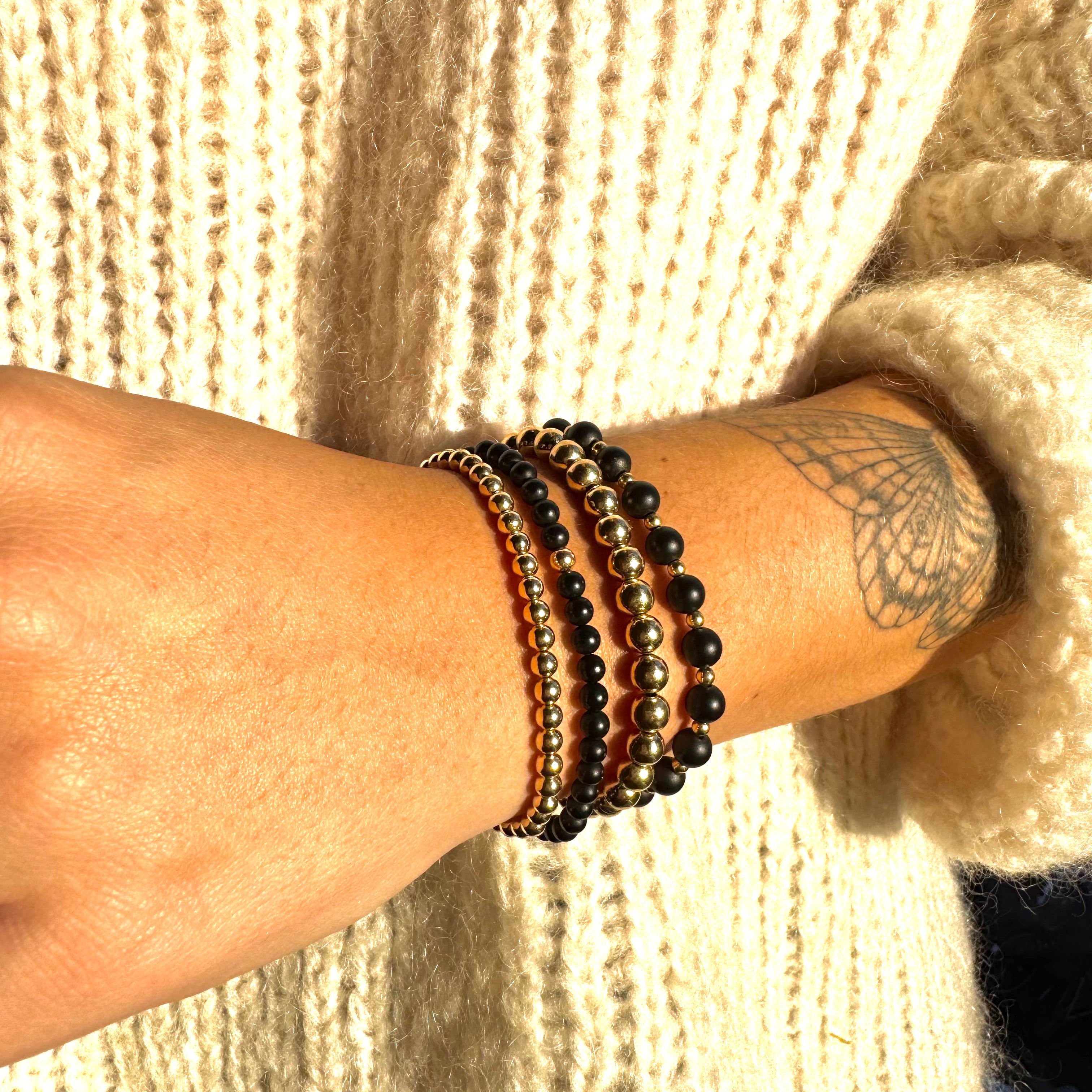 armband met zwarte matte onyx mat afgewisseld met goldfilled kralen
