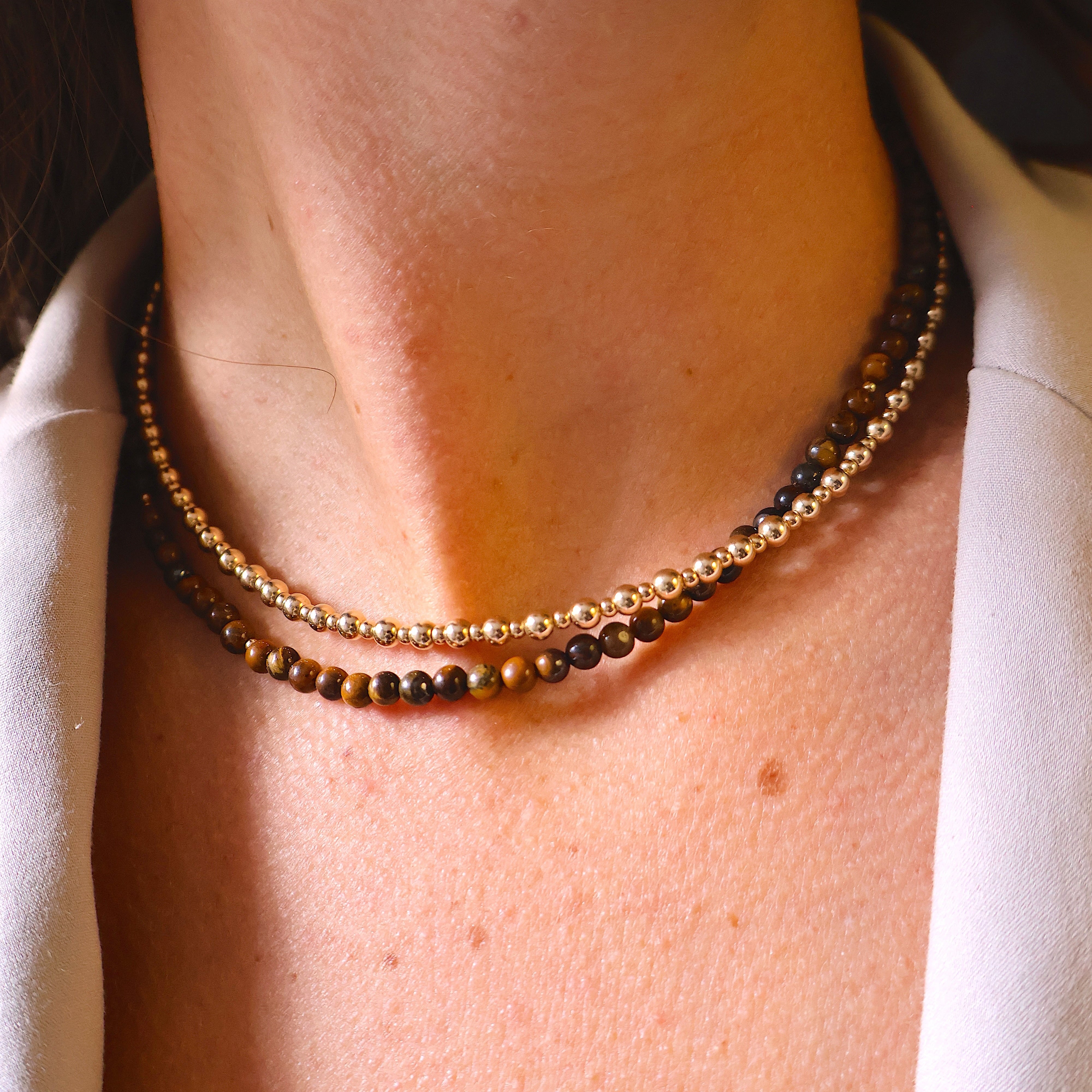 ketting van matte tijgeroog en sterling zilveren kralen