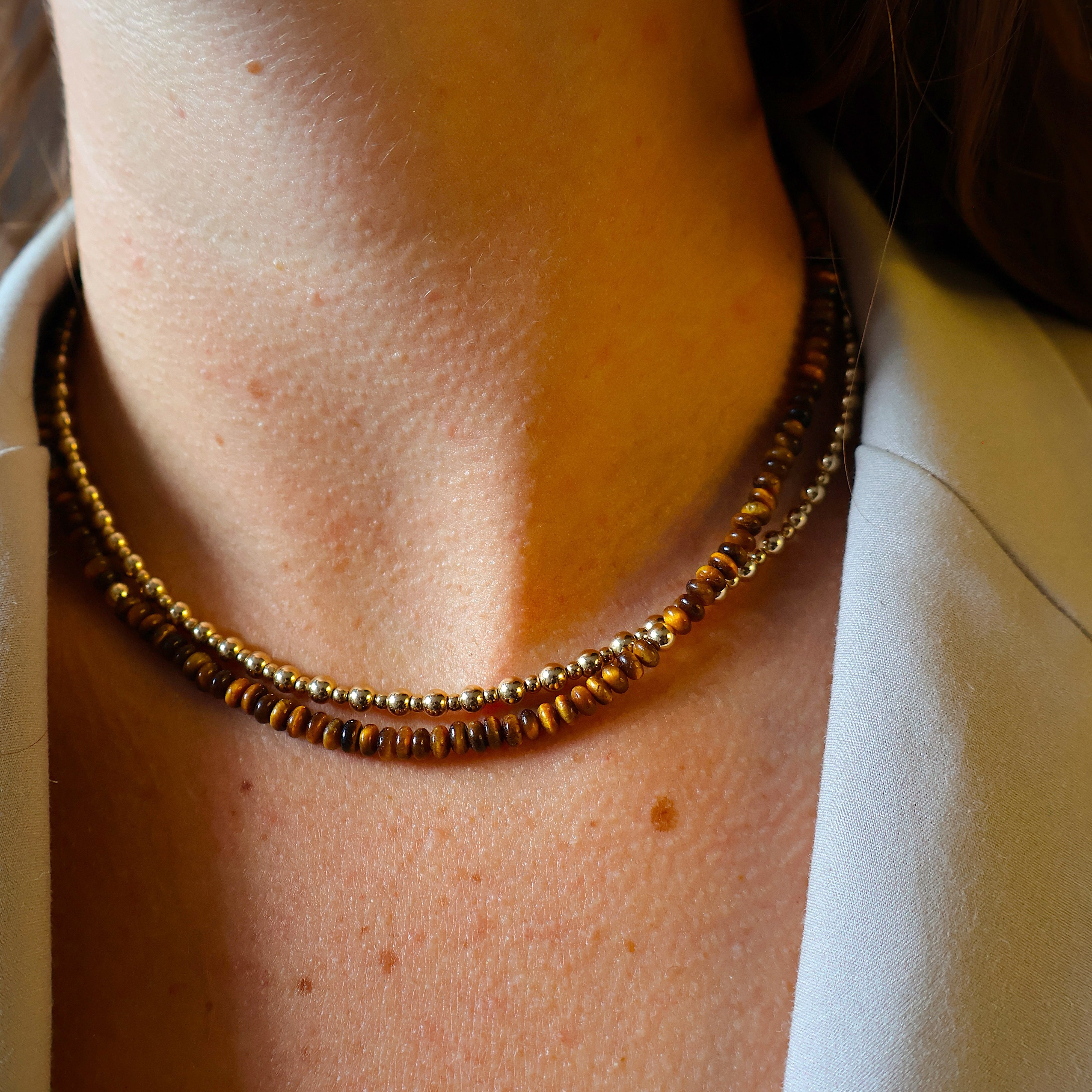 ketting van tijgeroog discs en goldfilled kraaltjes