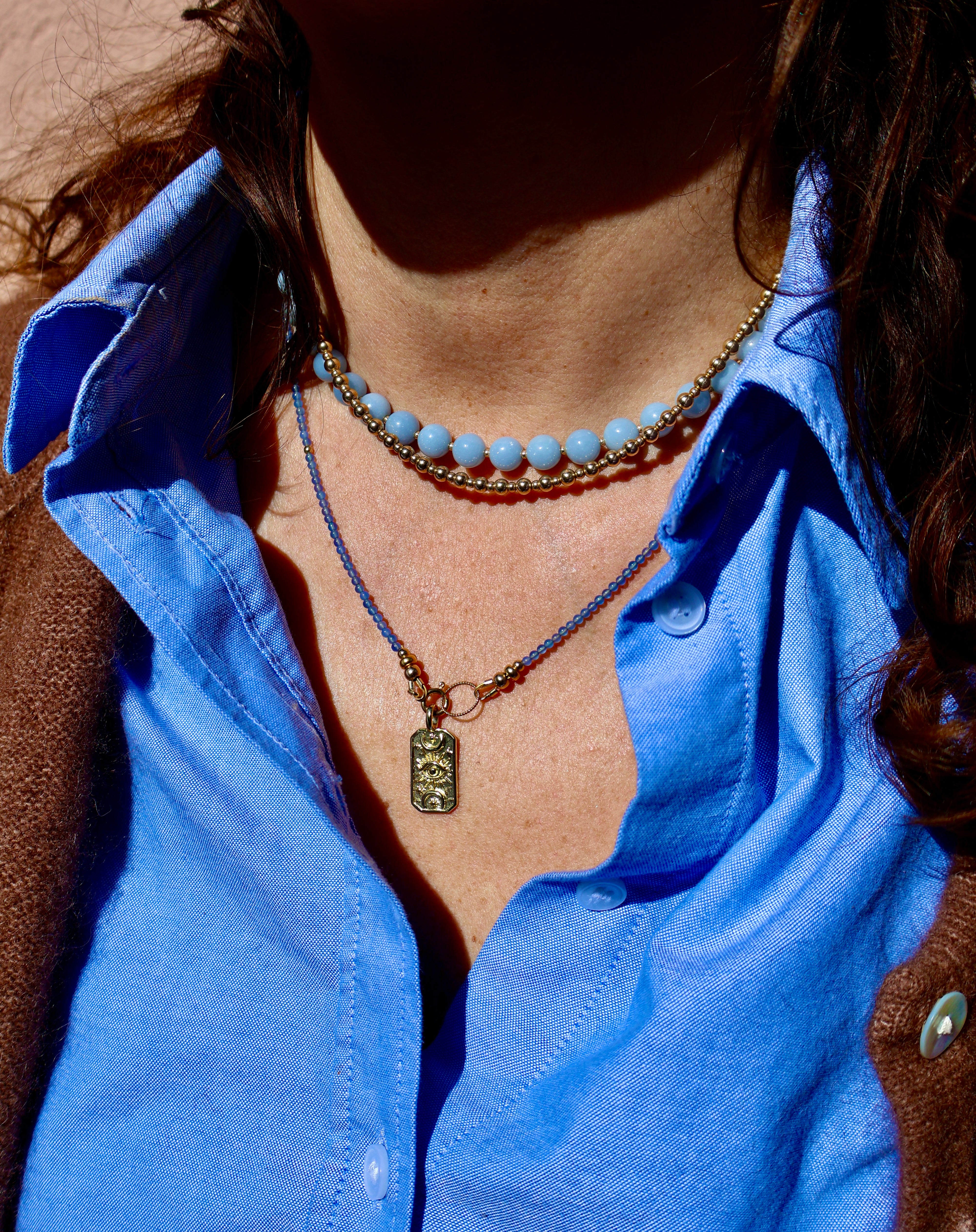 amulet met oog en manen