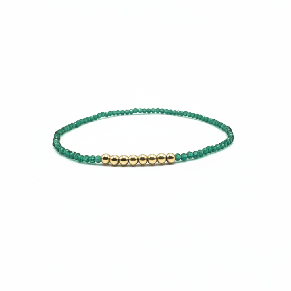 fijn armbandje van facet groen geslepen glas en goldfilled kraaltjes